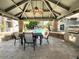 Relaxing community area with covered seating, grill, and pool view at 2025 E Campbell Ave # 330, Phoenix, AZ 85016