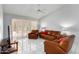Living room with leather furniture and access to patio at 8333 W Wescott Dr, Peoria, AZ 85382