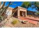 Landscaped backyard with patio, featuring drought-tolerant plants and gravel at 8333 W Wescott Dr, Peoria, AZ 85382