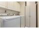 Laundry room with washer, dryer, and extra storage at 8333 W Wescott Dr, Peoria, AZ 85382
