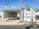 Front view of a manufactured home with covered patio at 225 S Motherlode Dr, Apache Junction, AZ 85119