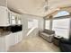 Bright sunroom features a comfy sofa and ample natural light at 225 S Motherlode Dr, Apache Junction, AZ 85119
