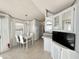 Eat-in kitchen with white cabinets and a breakfast table at 225 S Motherlode Dr, Apache Junction, AZ 85119