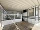 Covered patio with a table and chairs, adjacent to the home at 225 S Motherlode Dr, Apache Junction, AZ 85119