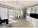 Bright dining area with white cabinets, tile flooring, and access to a patio at 225 S Motherlode Dr, Apache Junction, AZ 85119