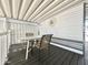 Covered patio with a table, chairs, and exterior door at 225 S Motherlode Dr, Apache Junction, AZ 85119