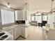 Kitchen with gray cabinets and a view into living room at 225 S Motherlode Dr, Apache Junction, AZ 85119