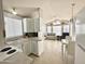 Open kitchen with view of living area and sunroom at 225 S Motherlode Dr, Apache Junction, AZ 85119