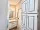 Bathroom features updated vanity and linen cabinets at 225 S Motherlode Dr, Apache Junction, AZ 85119