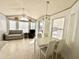 Living room with sunroom, sofa, and dining area at 225 S Motherlode Dr, Apache Junction, AZ 85119