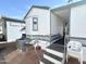 Exterior view with stairs and AC unit at 225 S Motherlode Dr, Apache Junction, AZ 85119