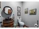 Charming bathroom features a rustic sink and framed artwork at 5604 S 225Th Ave, Buckeye, AZ 85326