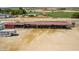 Spacious barn with multiple stalls and large covered area at 5604 S 225Th Ave, Buckeye, AZ 85326
