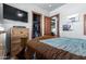Bedroom with wooden dresser and walk-in closet at 5604 S 225Th Ave, Buckeye, AZ 85326
