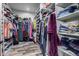 Large walk-in closet with ample shelving and hanging space at 5604 S 225Th Ave, Buckeye, AZ 85326