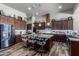 Spacious kitchen boasts granite countertops, stainless steel appliances, and ample cabinetry at 5604 S 225Th Ave, Buckeye, AZ 85326