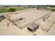 Large riding arena with multiple stalls and fencing at 5604 S 225Th Ave, Buckeye, AZ 85326