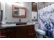 Bathroom with granite countertop, copper sink, and stylish shower curtain at 5604 S 225Th Ave, Buckeye, AZ 85326