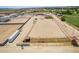 Aerial view of property with arena, stables, and house at 5604 S 225Th Ave, Buckeye, AZ 85326