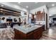 Open kitchen with granite island and breakfast bar at 5604 S 225Th Ave, Buckeye, AZ 85326