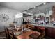 Rustic dining room features a large wooden table and chairs, perfect for Gathering gatherings at 5604 S 225Th Ave, Buckeye, AZ 85326