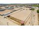 Large riding arena with multiple stalls and fencing at 5604 S 225Th Ave, Buckeye, AZ 85326