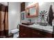 Bathroom with copper sink, granite countertop, and rustic decor at 5604 S 225Th Ave, Buckeye, AZ 85326