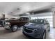 Garage with multiple vehicles and high ceilings at 5604 S 225Th Ave, Buckeye, AZ 85326