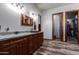 Bathroom with double vanity and granite countertop at 5604 S 225Th Ave, Buckeye, AZ 85326