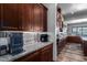 Kitchen features a dedicated coffee bar with granite countertop at 5604 S 225Th Ave, Buckeye, AZ 85326