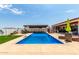 Sparkling blue pool with expansive patio and pergola at 5604 S 225Th Ave, Buckeye, AZ 85326
