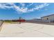 Private outdoor basketball court with painted lines at 5604 S 225Th Ave, Buckeye, AZ 85326
