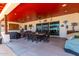 Covered patio with dining area and access to backyard at 5604 S 225Th Ave, Buckeye, AZ 85326