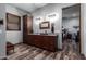 Bathroom with double vanity and access to walk-in closet at 5604 S 225Th Ave, Buckeye, AZ 85326