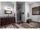 Bathroom with walk-in shower and wood vanity at 5604 S 225Th Ave, Buckeye, AZ 85326