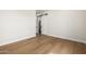 Spacious bedroom with hardwood floors and barn door to closet at 25219 S 194Th St, Queen Creek, AZ 85142