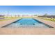 Inviting rectangular pool with brick surround and grassy area at 25219 S 194Th St, Queen Creek, AZ 85142