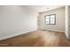 Bright bedroom with hardwood floors and large window at 25219 S 194Th St, Queen Creek, AZ 85142