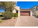 Single story home with brown garage door and landscaped front yard at 12146 W Dale Ln, Peoria, AZ 85383