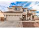 Two-story house with a large driveway and landscaping at 18309 W Desert Ln, Surprise, AZ 85388