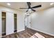 Well-lit bedroom featuring wood-look floors and ample closet space at 724 E Joan D Arc Ave, Phoenix, AZ 85022