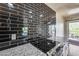 Kitchen detail showing granite countertops and dark tile backsplash at 724 E Joan D Arc Ave, Phoenix, AZ 85022