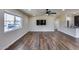 Bright living room featuring wood-look floors and a large window at 724 E Joan D Arc Ave, Phoenix, AZ 85022