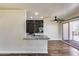 Modern kitchen with granite countertops and dark tile backsplash at 724 E Joan D Arc Ave, Phoenix, AZ 85022