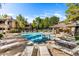 Community swimming pool with lounge chairs and a covered patio area at 15252 N 100Th St # 1164, Scottsdale, AZ 85260