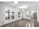 Bright, open kitchen and dining area with white cabinets, stainless steel appliances, and wood-look flooring at 1315 E Gemini Dr, Tempe, AZ 85283