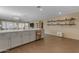 Open kitchen with island and grey cabinets at 27406 N 172Nd Ave, Surprise, AZ 85387