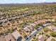 Aerial view of a residential neighborhood with houses, pools, and desert landscape at 4657 E Matt Dillon Trl, Cave Creek, AZ 85331