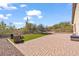 Artificial turf backyard with a patio, seating area, and trampoline at 4657 E Matt Dillon Trl, Cave Creek, AZ 85331