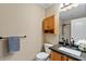 Clean bathroom with granite countertop and wood cabinets at 4657 E Matt Dillon Trl, Cave Creek, AZ 85331